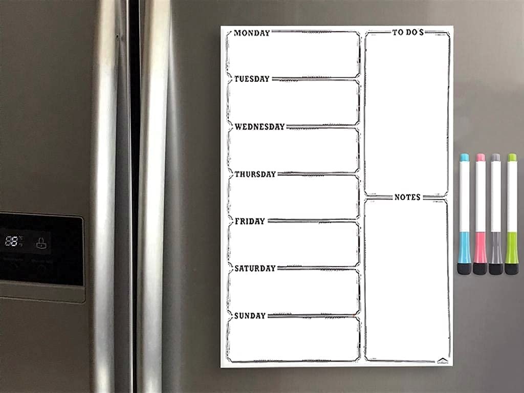 A magnetic dry erase planner on a fridge 