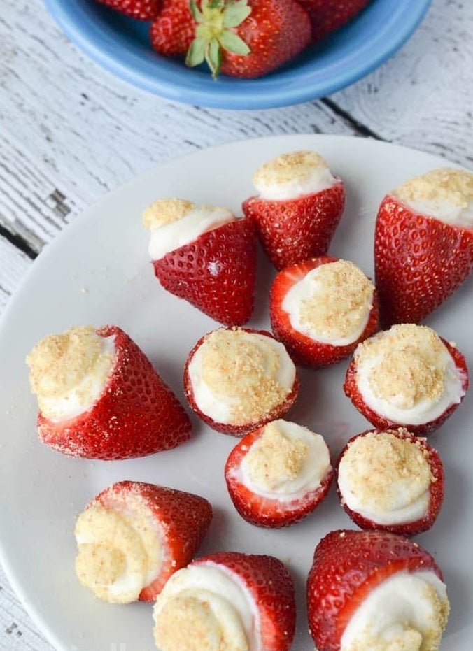 Strawberries stuffed with cheesecake filling.