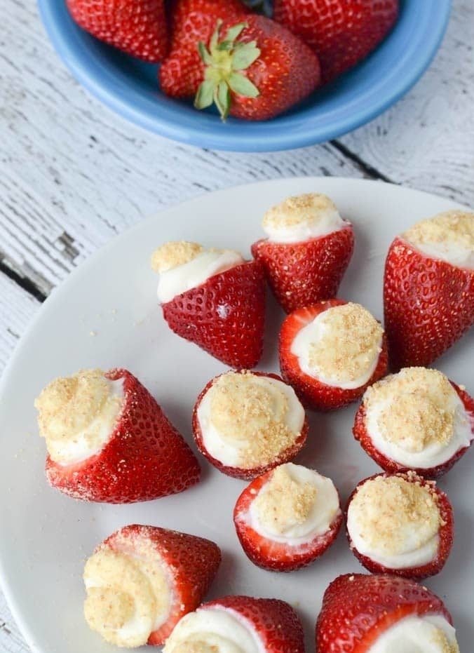 Strawberries stuffed with cheesecake filling.