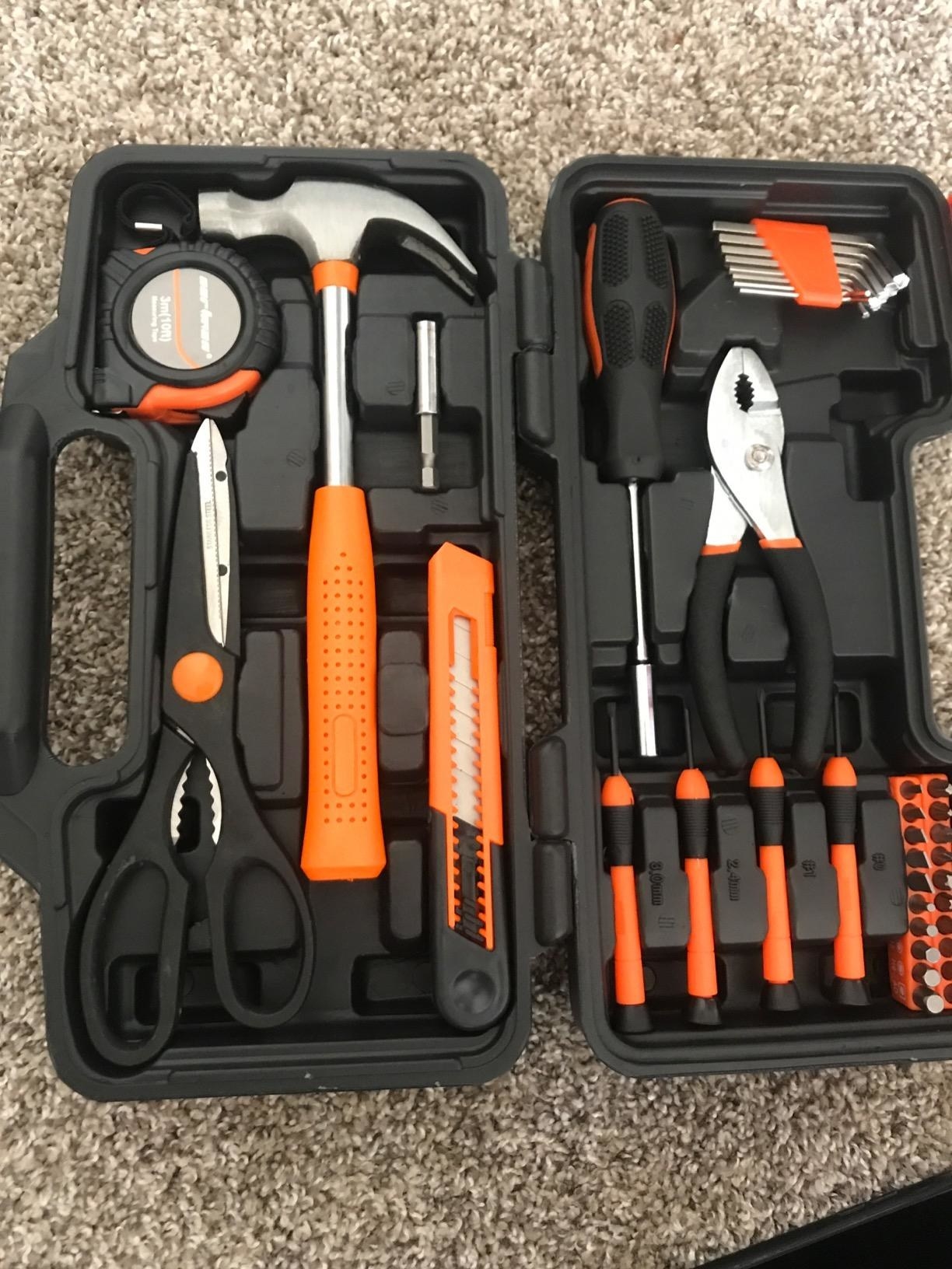 a reviewer&#x27;s black and orange tool kit