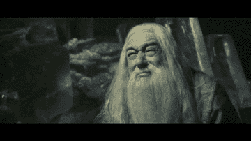 Dumbledore cries as Harry cries and brings a bowl of poison to hisl ips