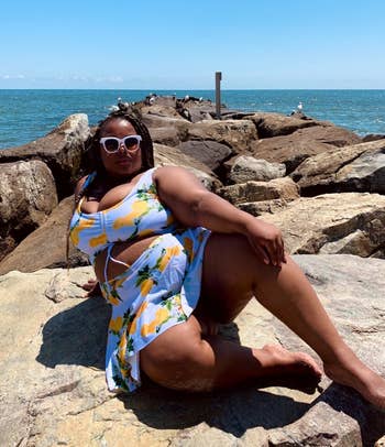 reviewer poses in pineapple tankini with long top that looks like dress