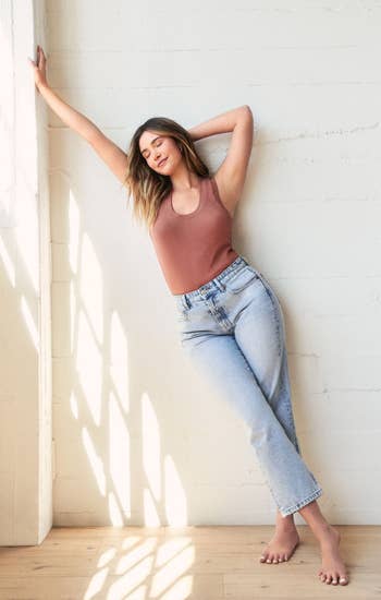 model wearing tank with jeans