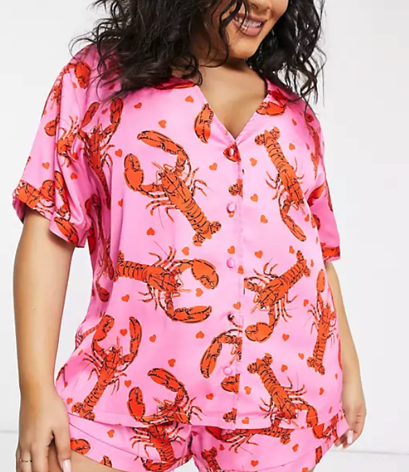 model wearing matching top and bottom set with lobster heart print