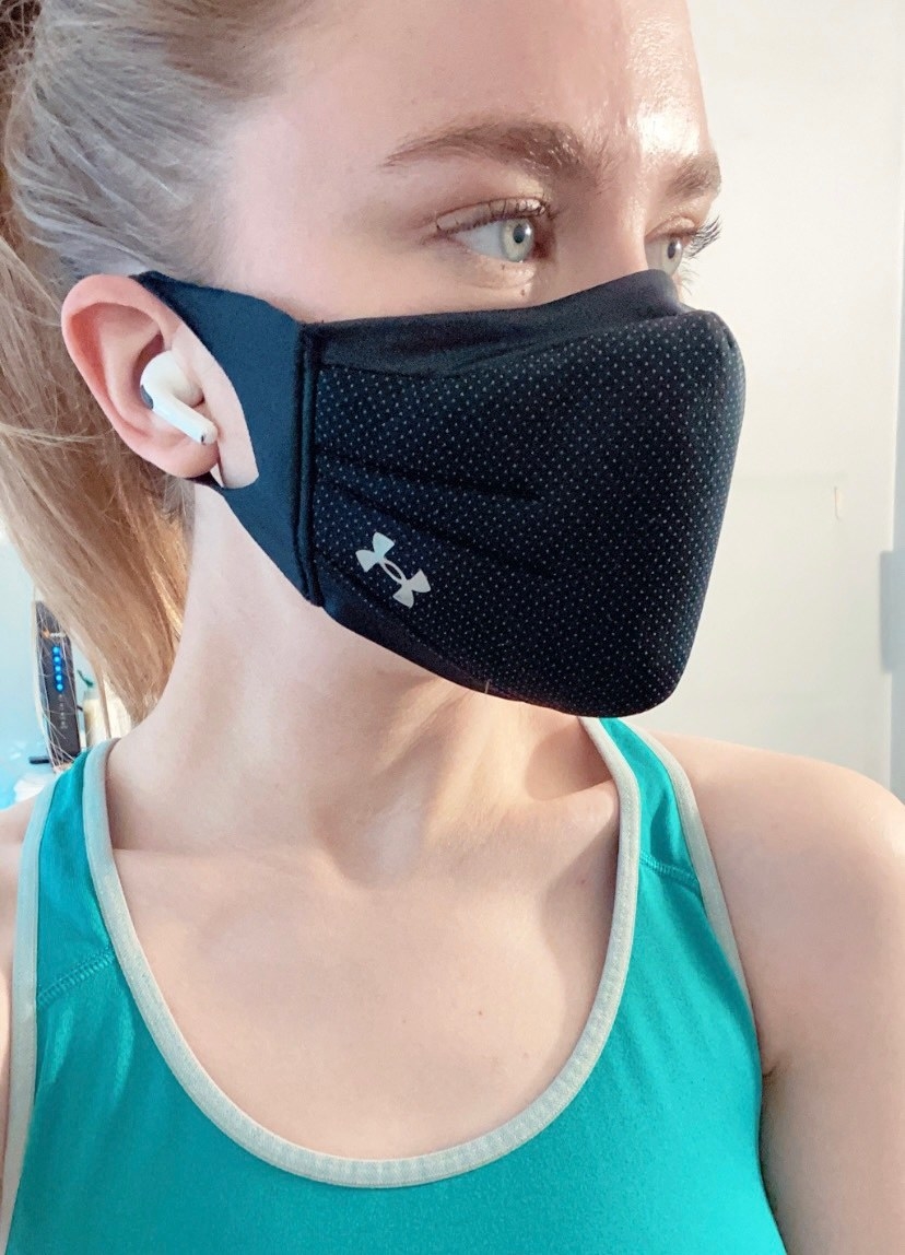 BuzzFeed editor in workout gear wearing AirPods Pro in ears 