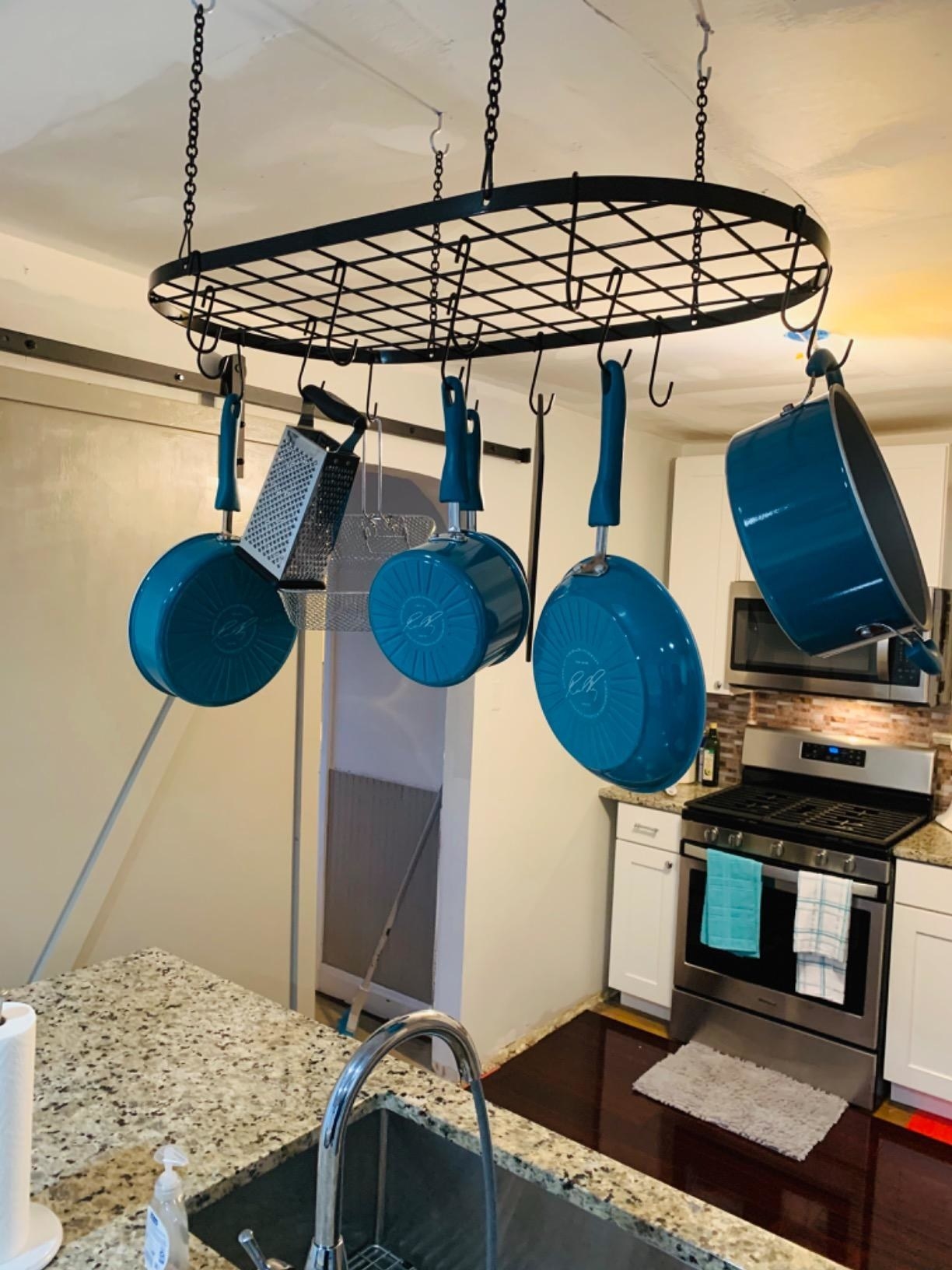 the ceiling mount holding a set of matching pots and pans