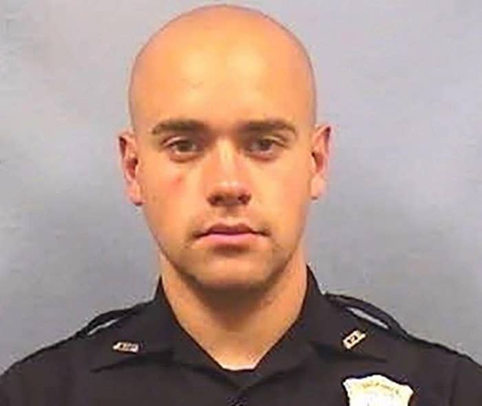 A bald white man in a police uniform.
