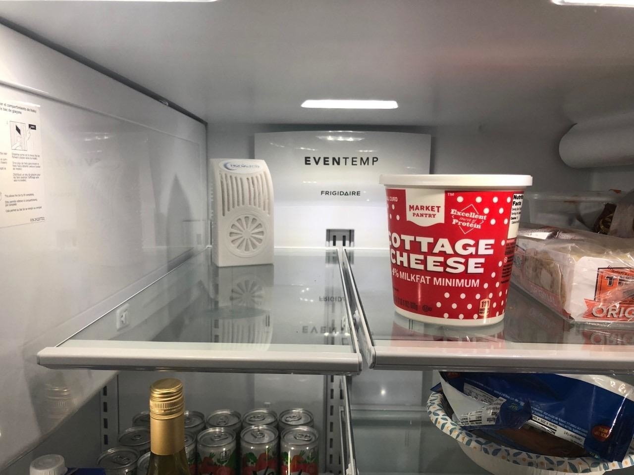 The deodorizer on a kitchen fridge shelf