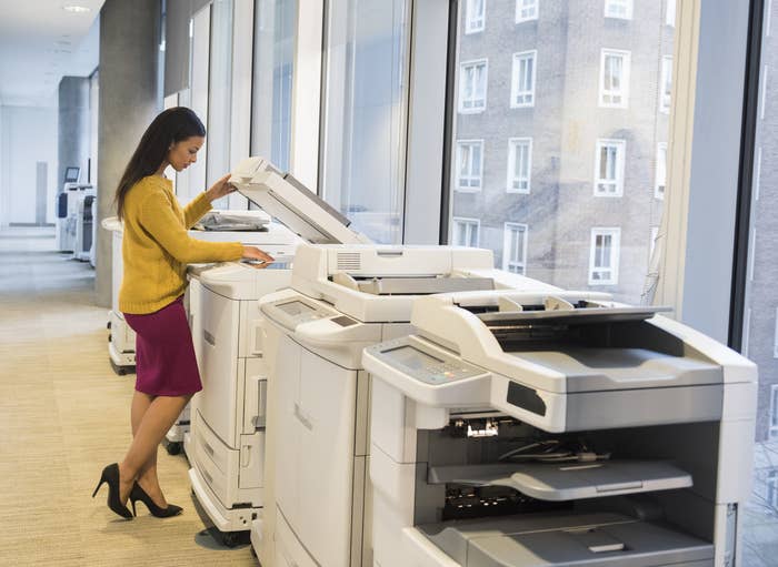 Businesswoman using a printer