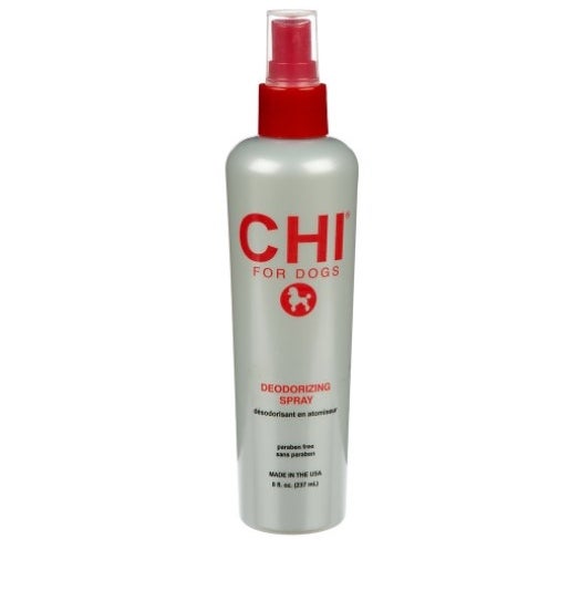 The deodorizing dog spray in a gray bottle with red lettering
