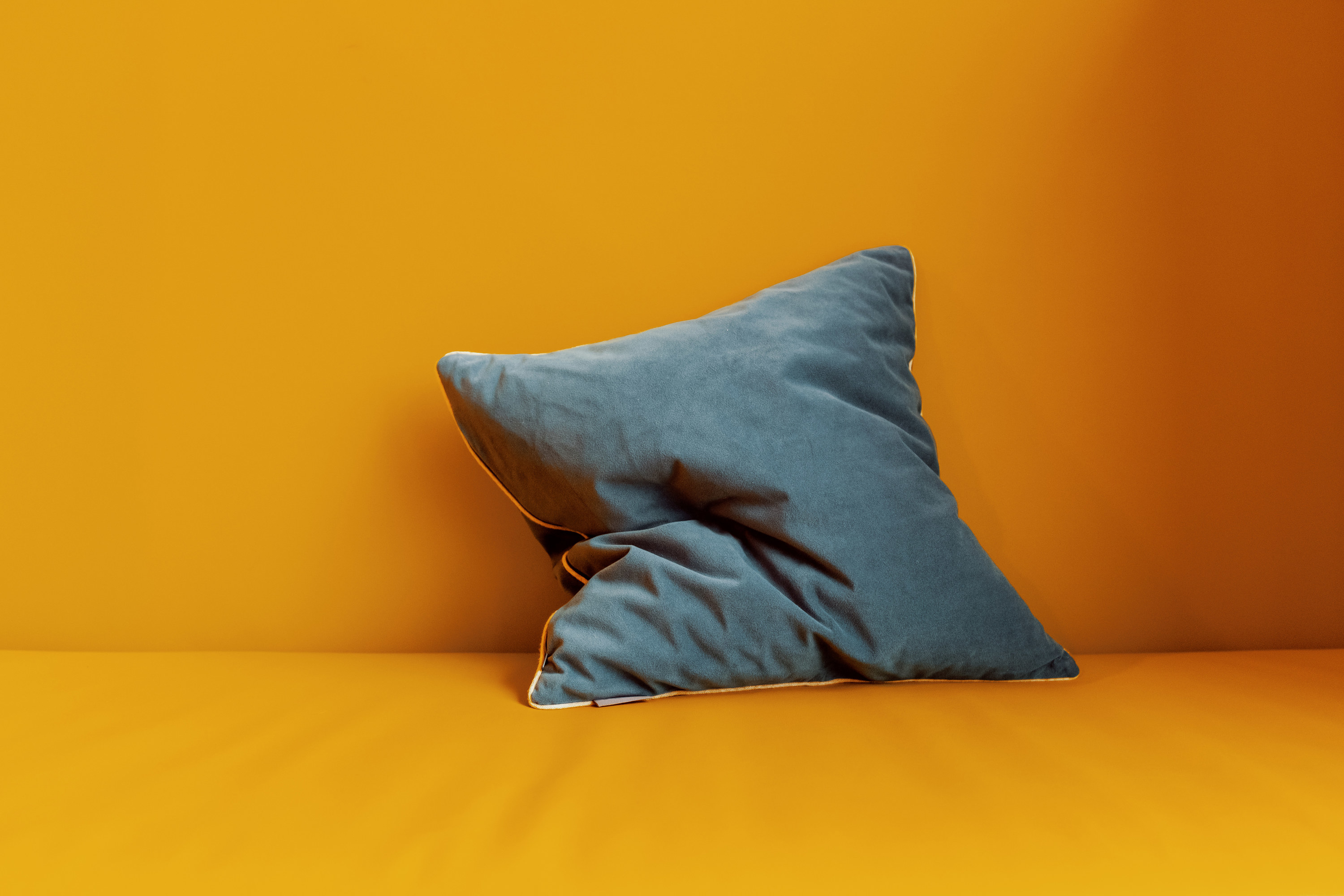 An image of a pillow on an orange background 