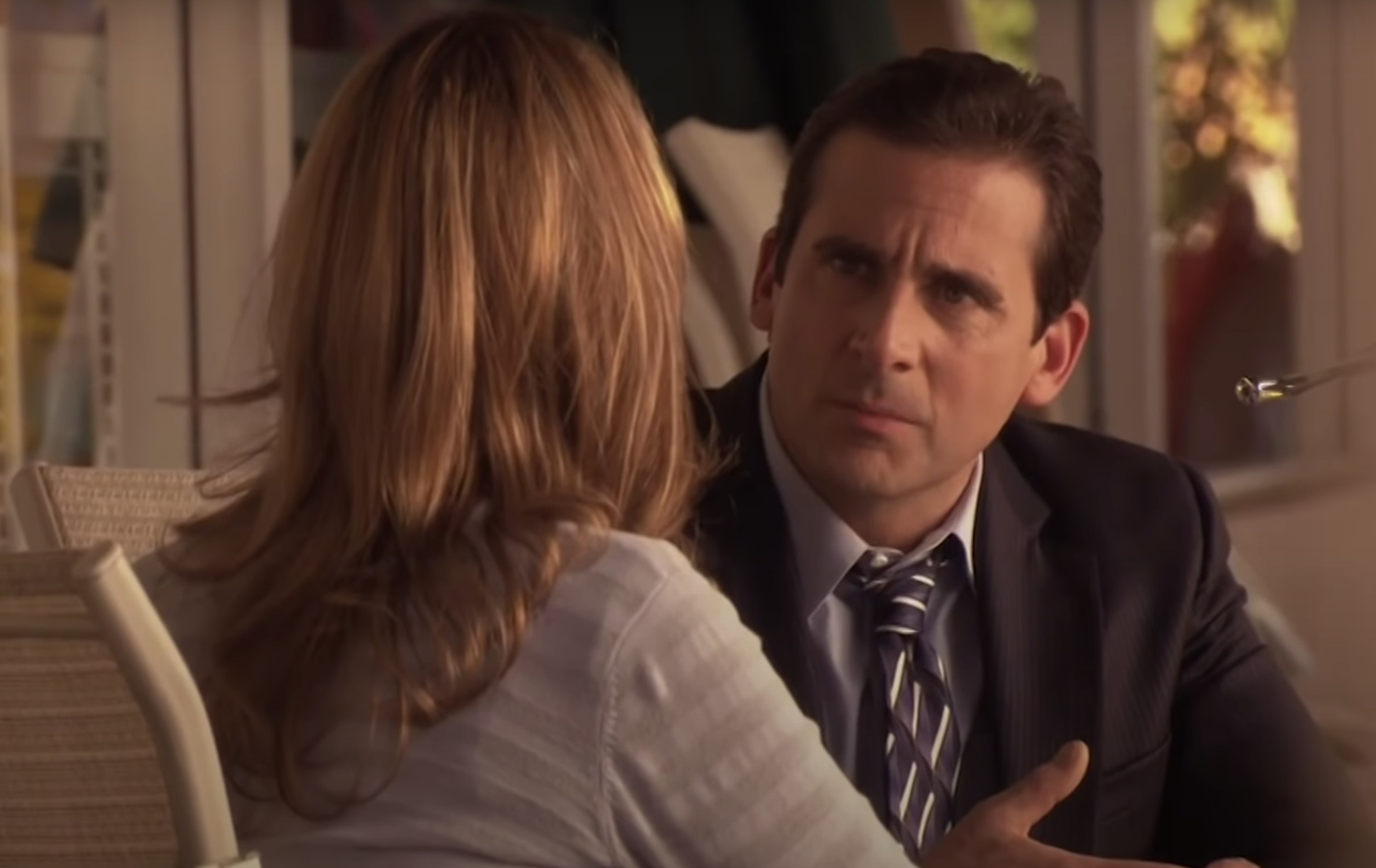 Michael looks at Jan while she talks about her pregnancy