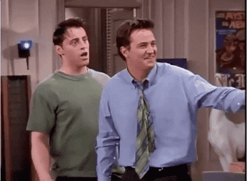 Joey poking Chandler in the shoulder