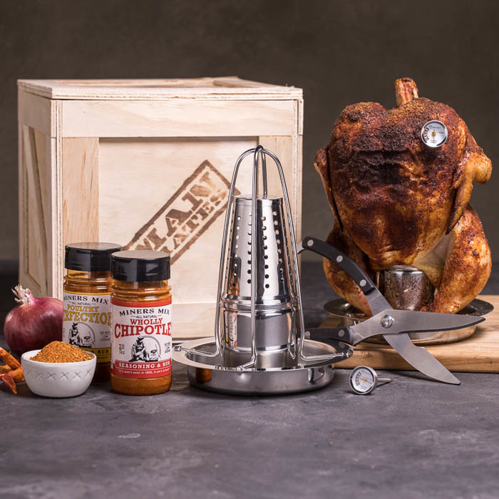 The beer can crate with a chicken sitting on one as an example and the seasonings that are included in the kit