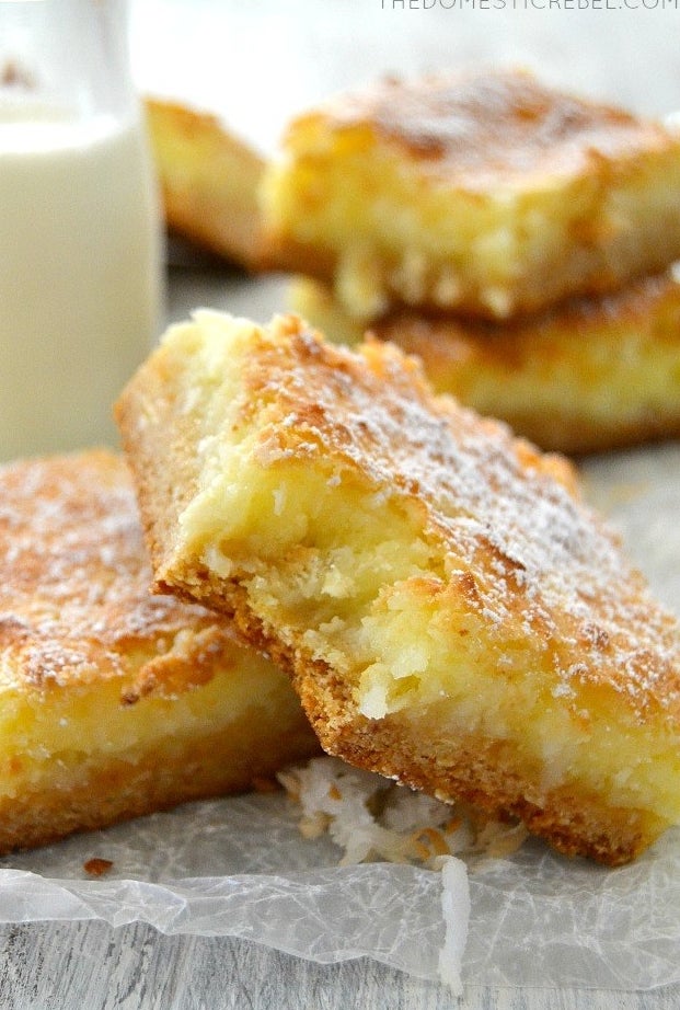 A close up of two coconut cream pie bars.