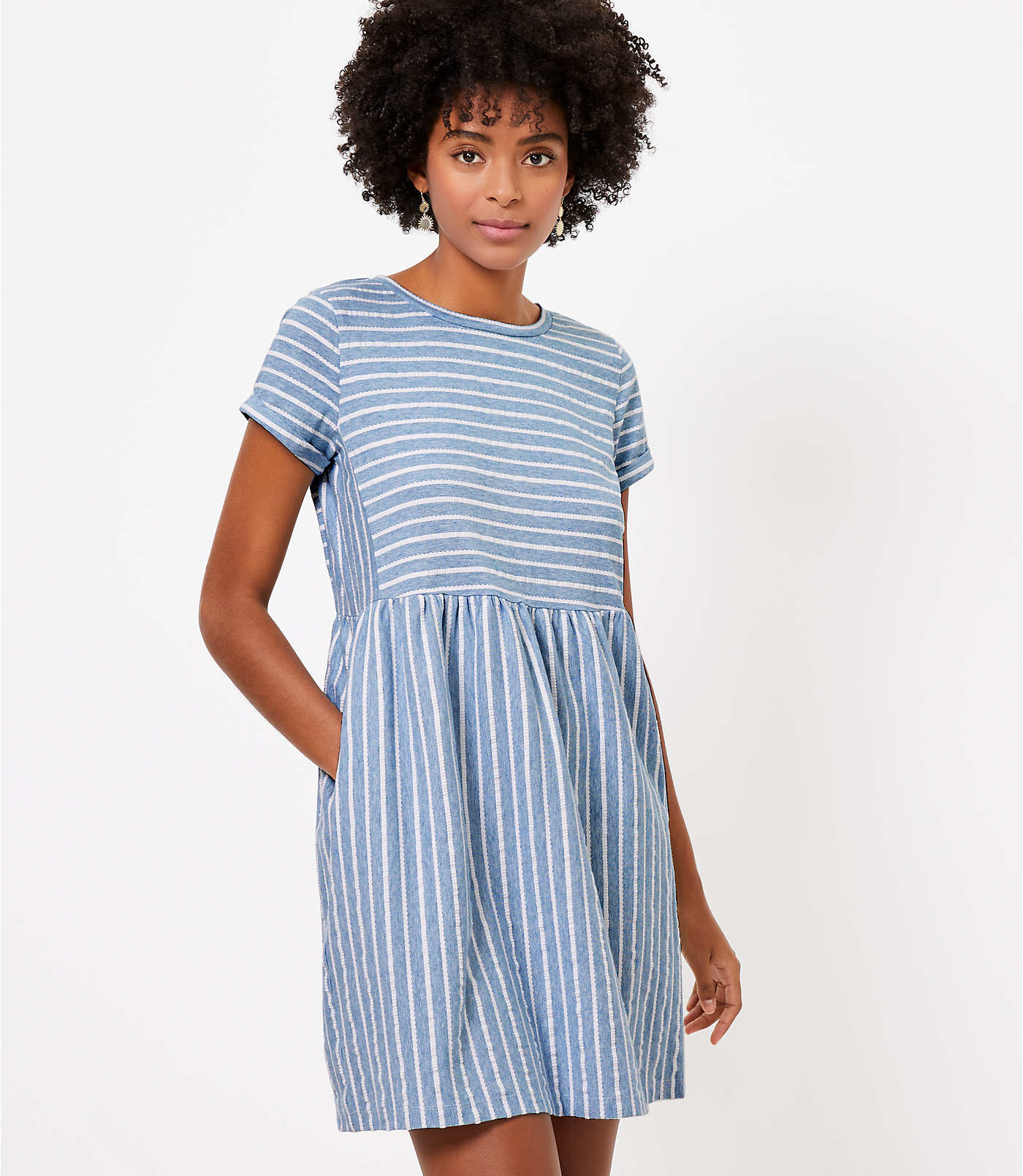 model wearing blue and white striped dress