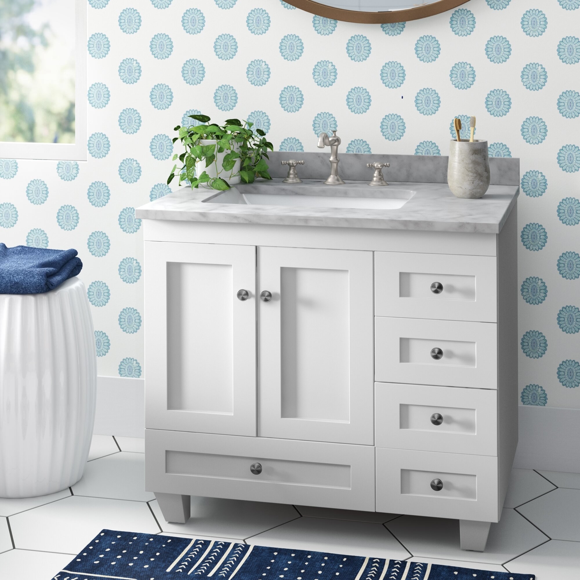 the white vanity set with sink built in and accessories on top