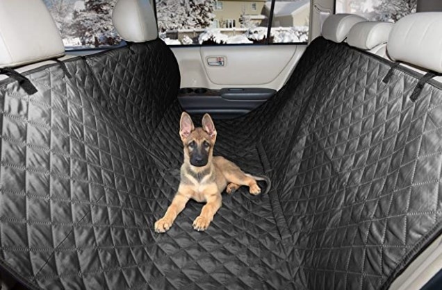 A german shepherd puppy laying on the protective mat