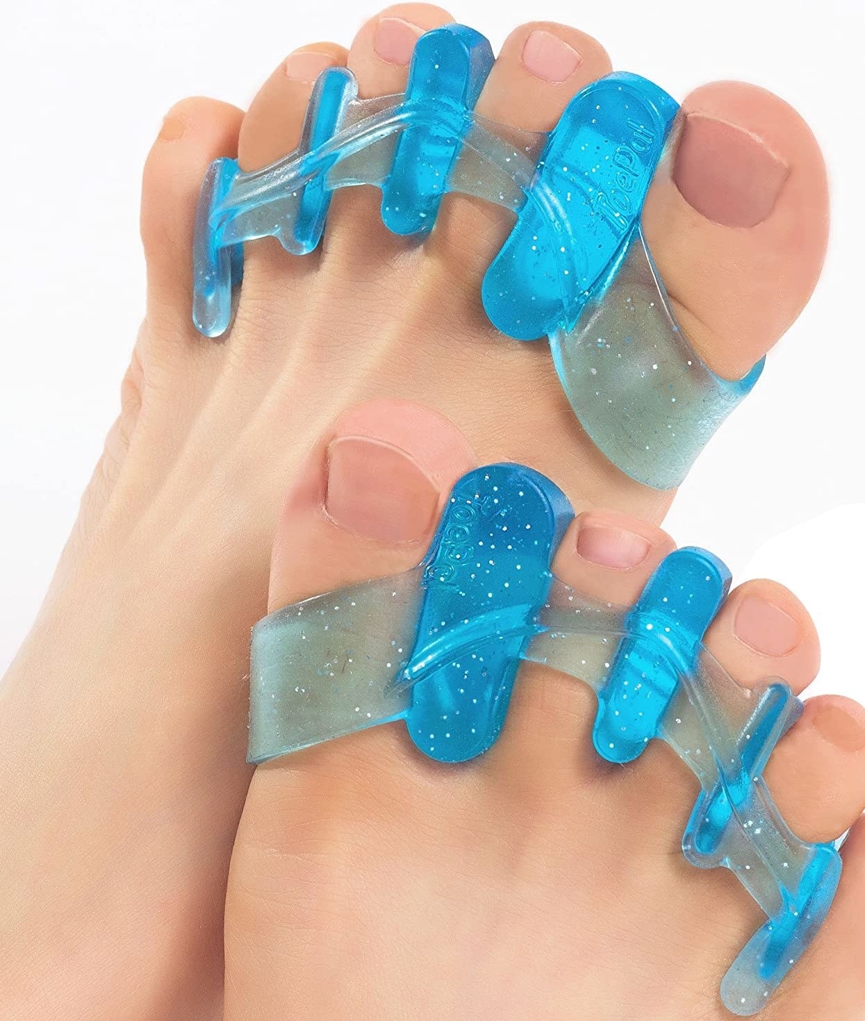 Two feet with a pair of gel separators between each toe