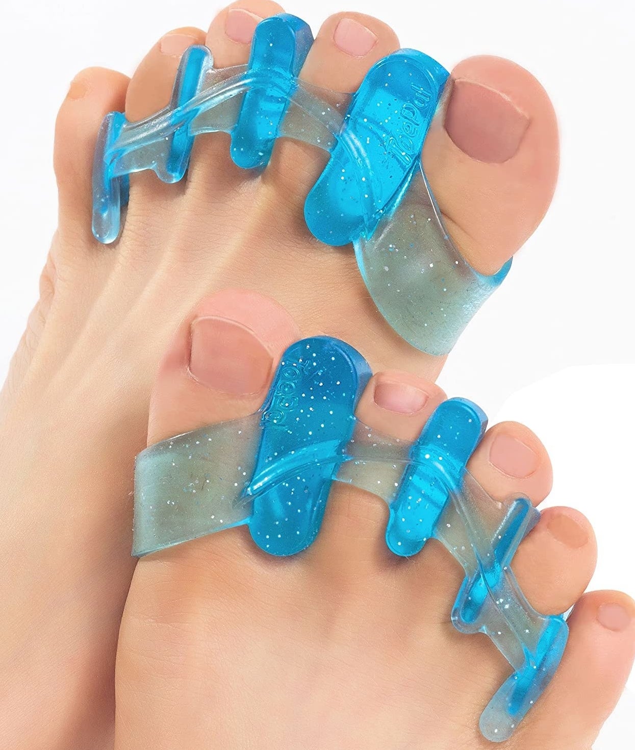 Two feet with a pair of gel separators between each toe