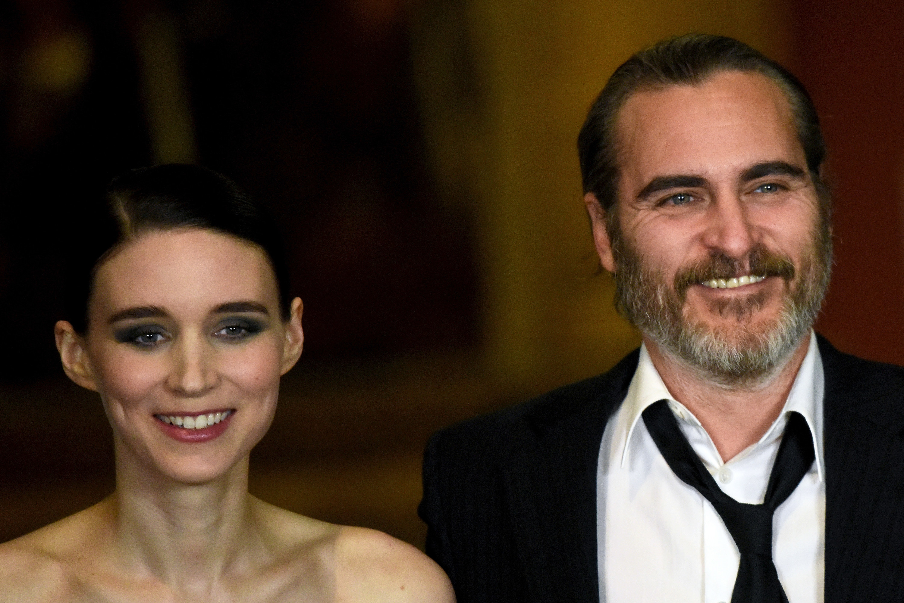 Rooney and Joaquin smiles while onstage at a movie screening