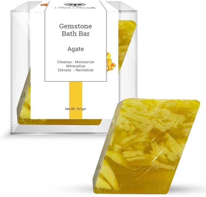 An agate gemstone soap bar next to its box