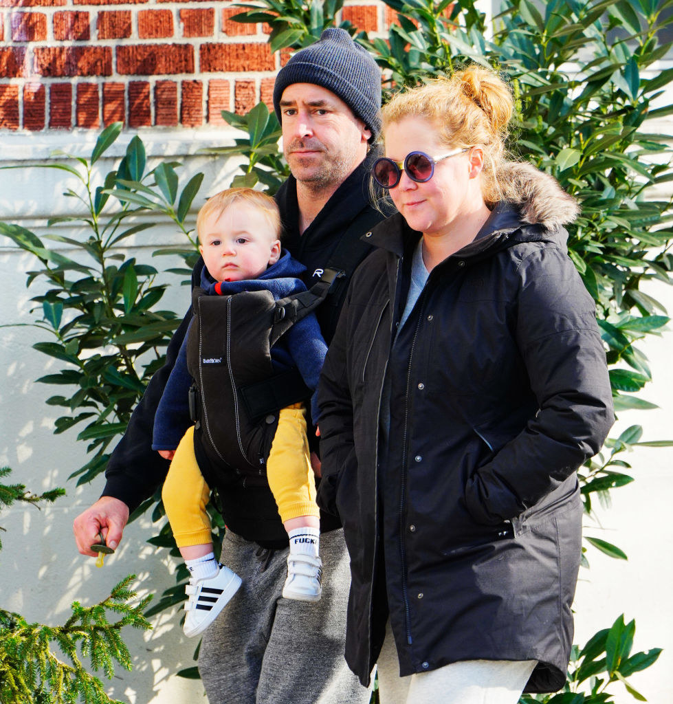 Amy Schumer (R) and Chris Fischer take baby Gene Fischer out for some morning air