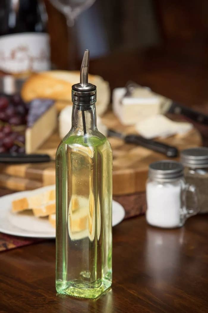 Olive oil bottle on table