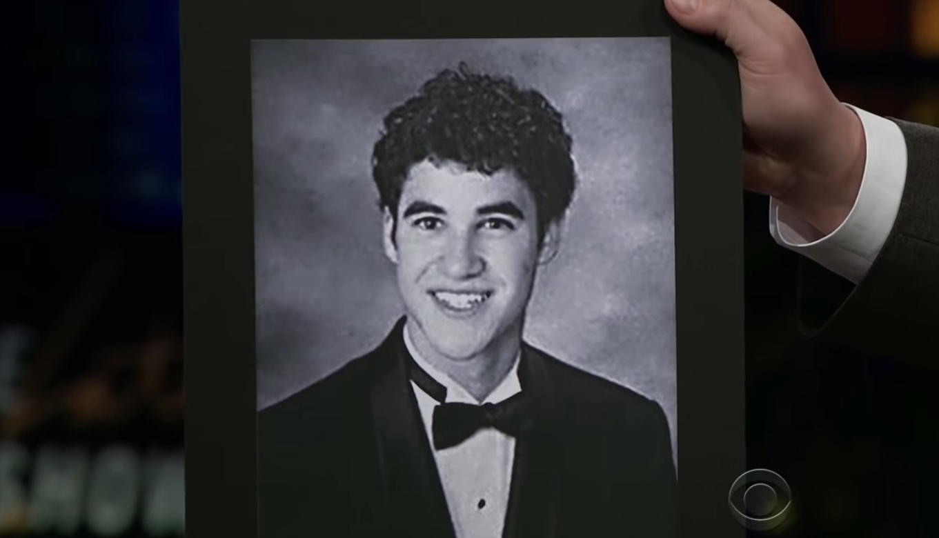 James Corden showing a high school photo of Darren on his show