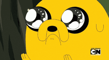 Jake from Adventure time looking at something in awe with sparkles in his eyes 