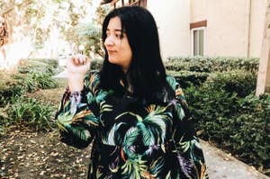 reviewer wears dress in leafy design