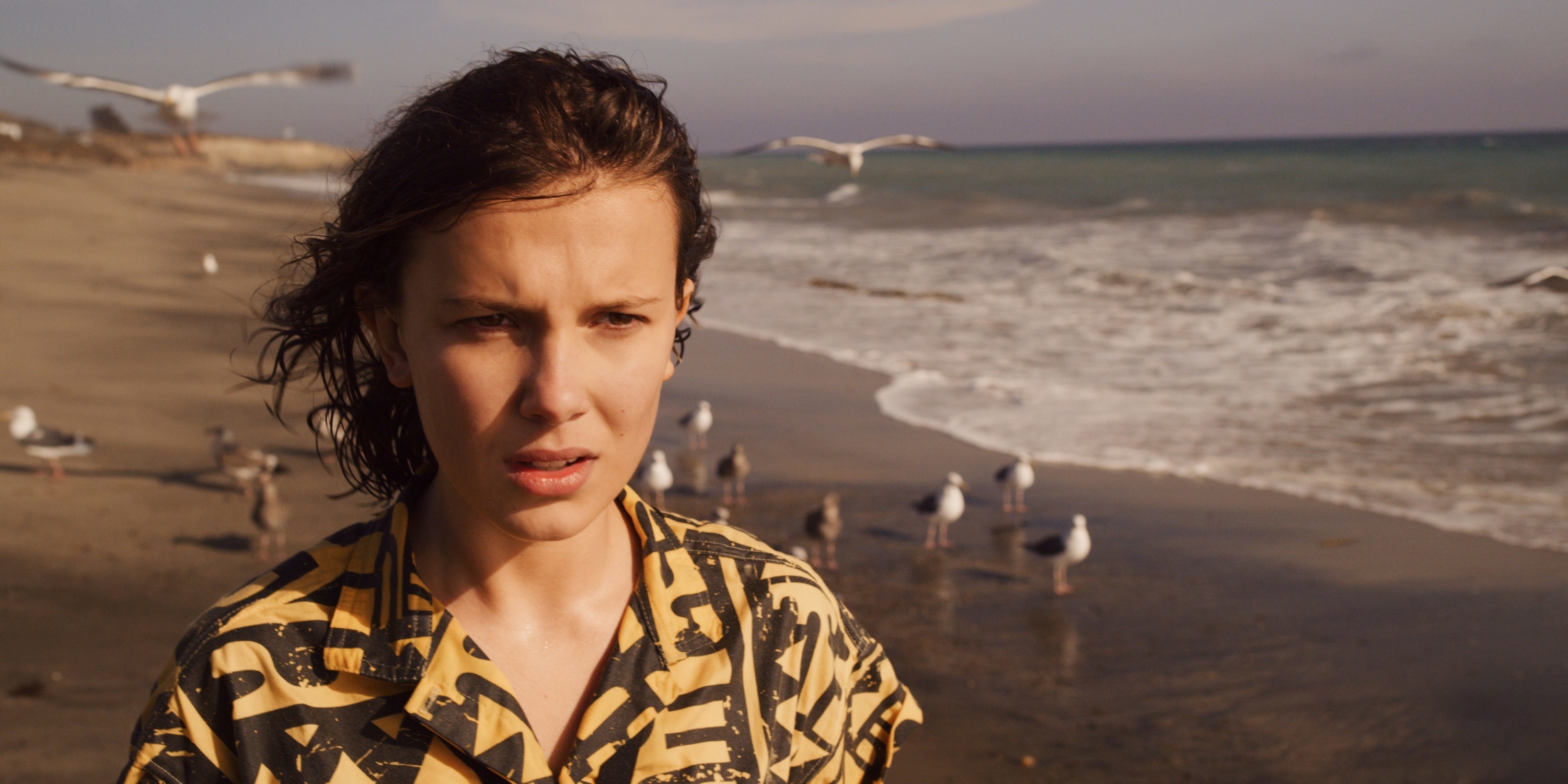 Eleven standing on a beach