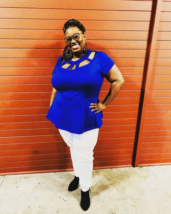 reviewer wearing the blue peplum top in a 3X