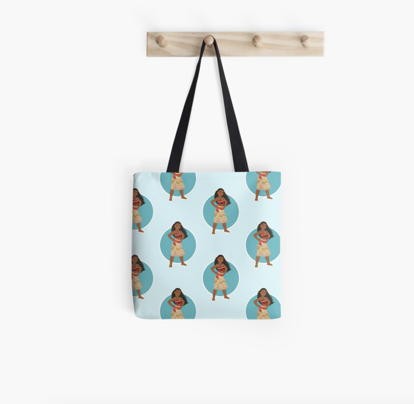 the tote bag in blue with Moana figures all over it and a black strap