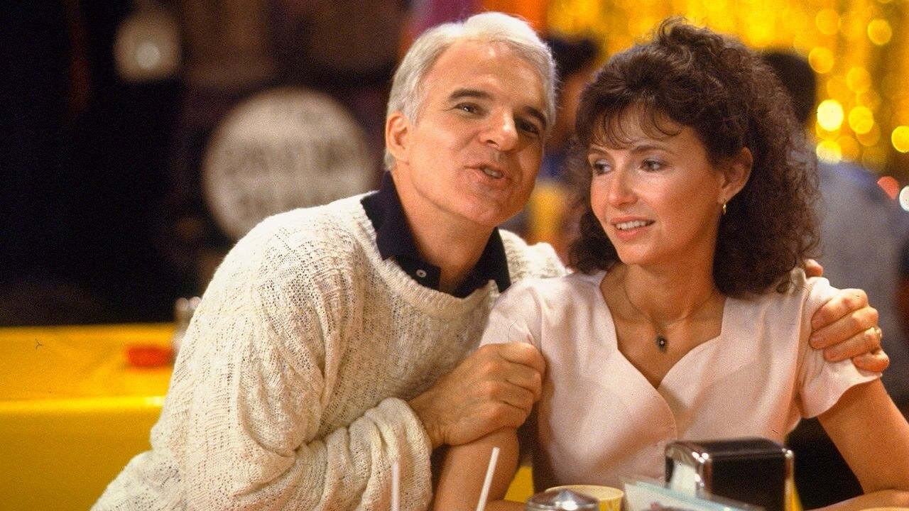 Steve Martin as Gil embracing Mary Steenburgen as Karen at a table at a restaraunt
