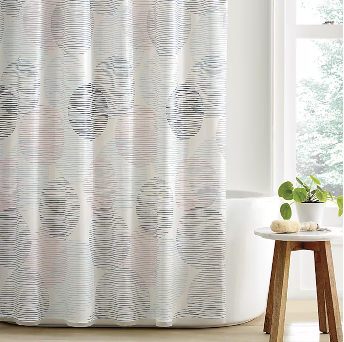 Shower curtain with lined design in ovals throughout