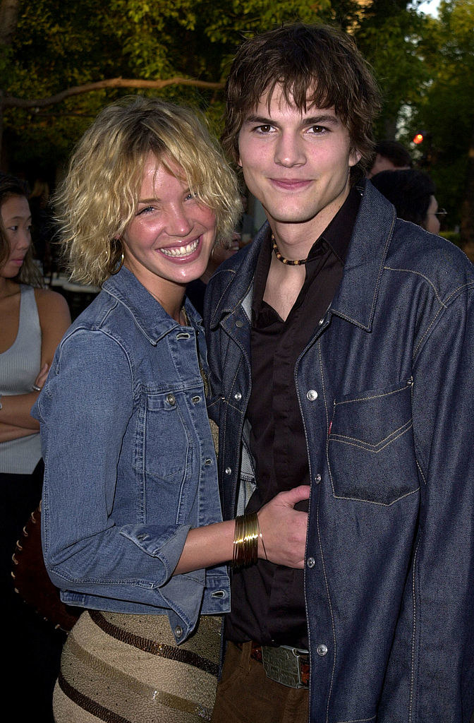 Ashton Kutcher and Ashley Scott absolutely beaming