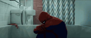 Spider-Man crying in costume in the shower