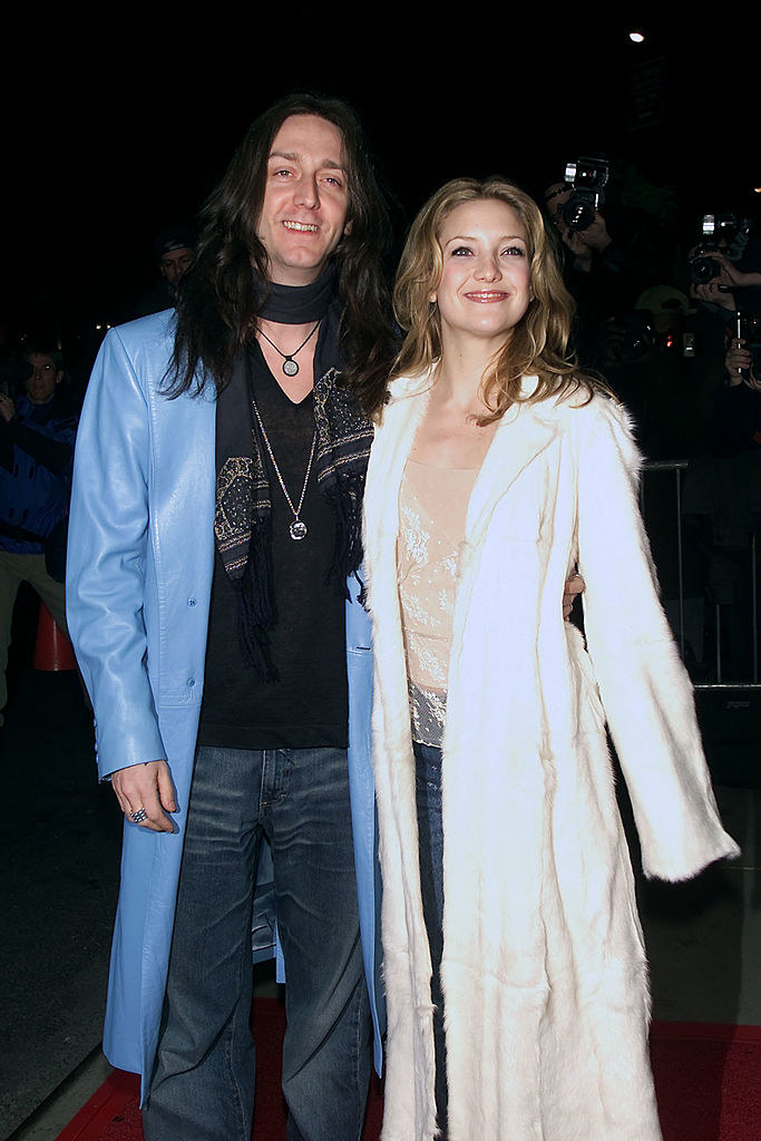 Chris Robinson and Kate Hudson in long, flowy jackets