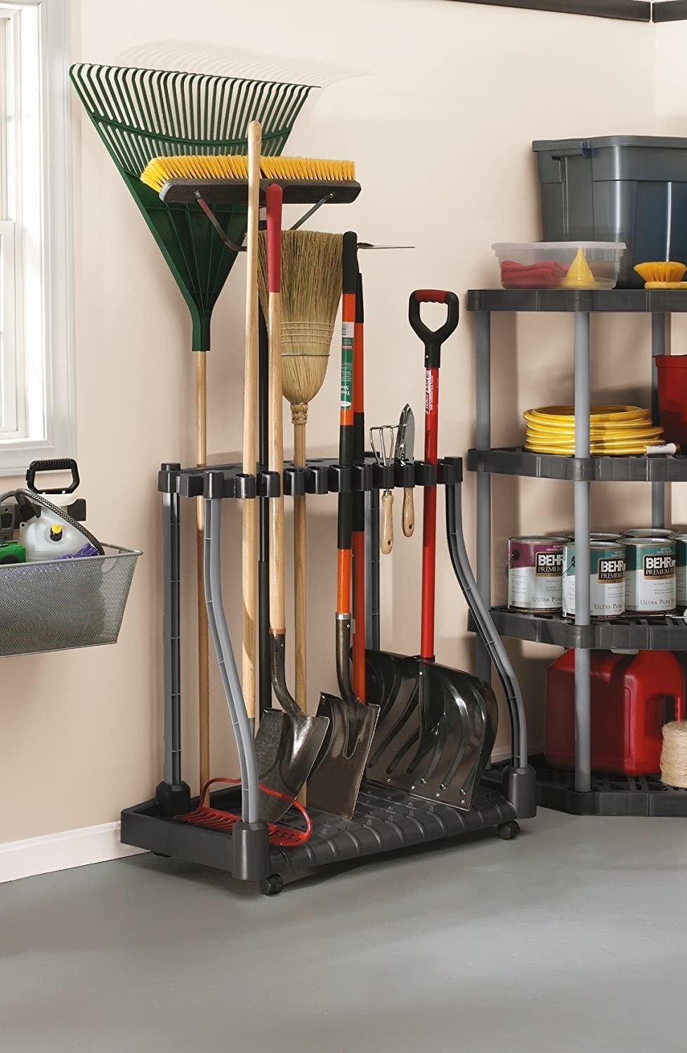 shovels and rakes in the tool organizer