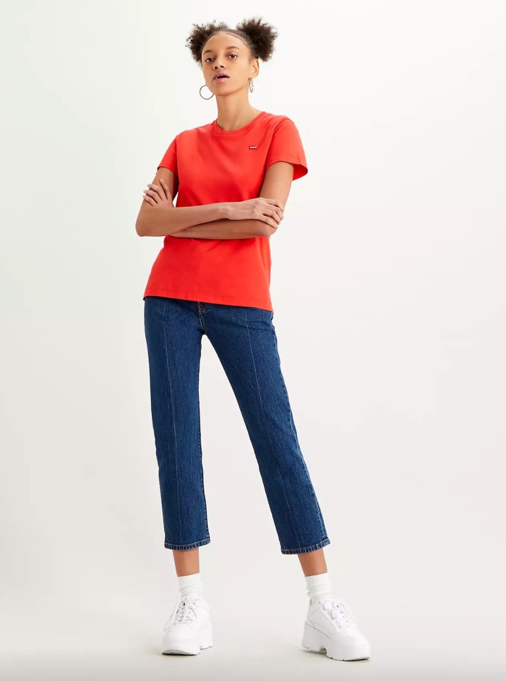 The pair of 501 cropped jeans on model wearing a red t-shirt