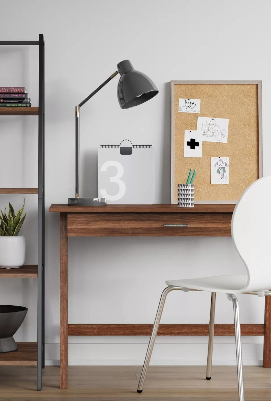 The brown wood desk with one drawer in a home office