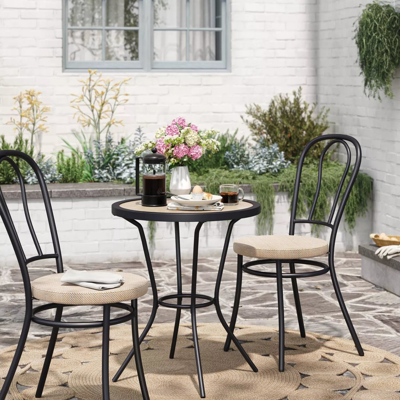 The black and wood patio set in a backyard