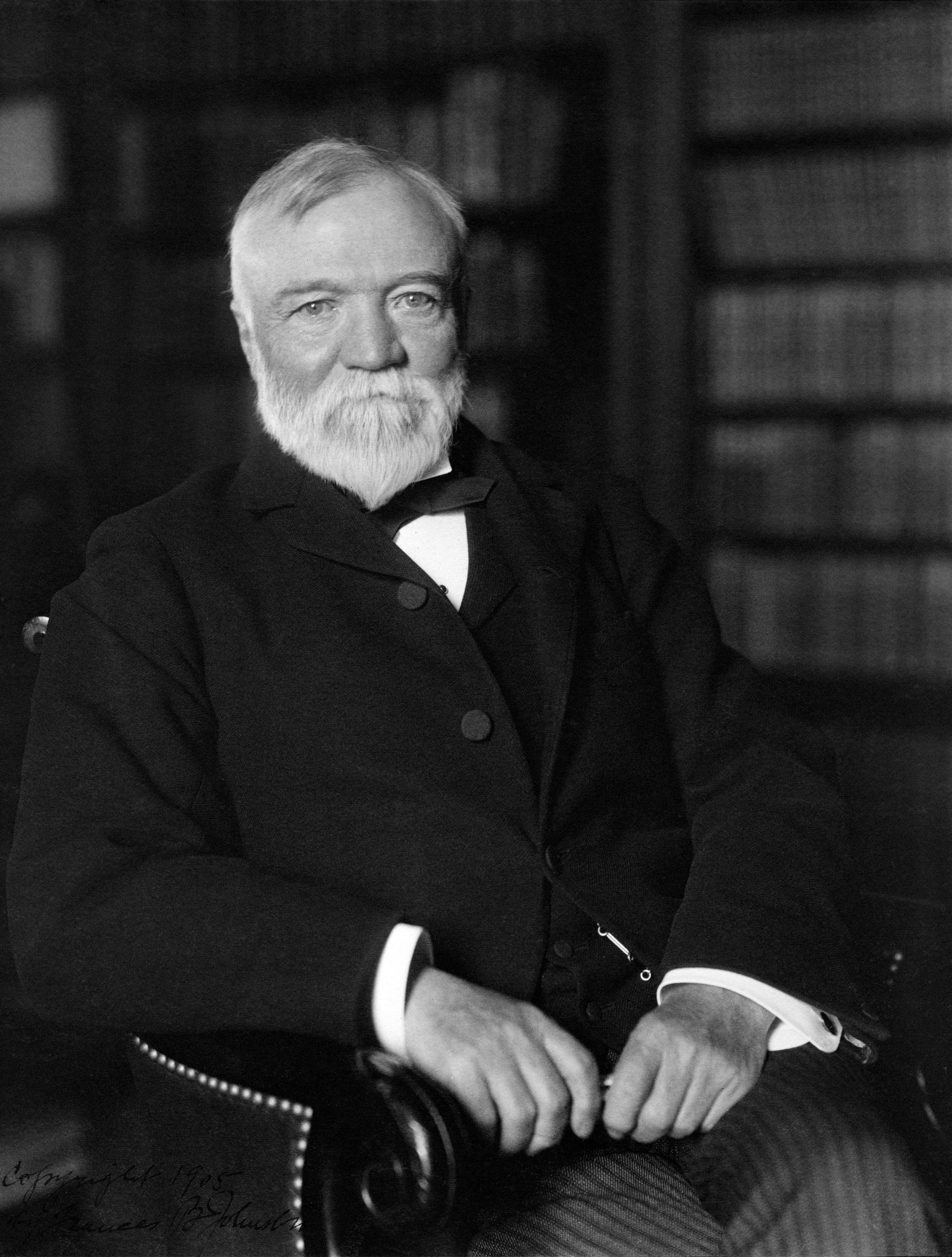 Black-and-white photo of Andrew Carnegie sitting in a chair