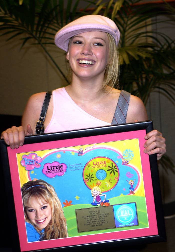 Hillary holding a Lizzie McGuire plaque