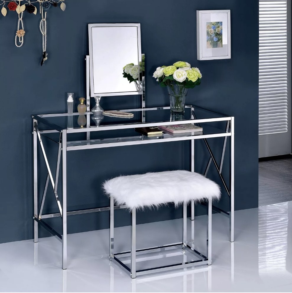 A chrome vanity set with a white faux-fur covered seat