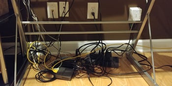 Reviewer's tangled cords under desk