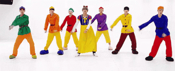 The members of BTS flossing while dressed as Snow White and the Seven Dwarfs
