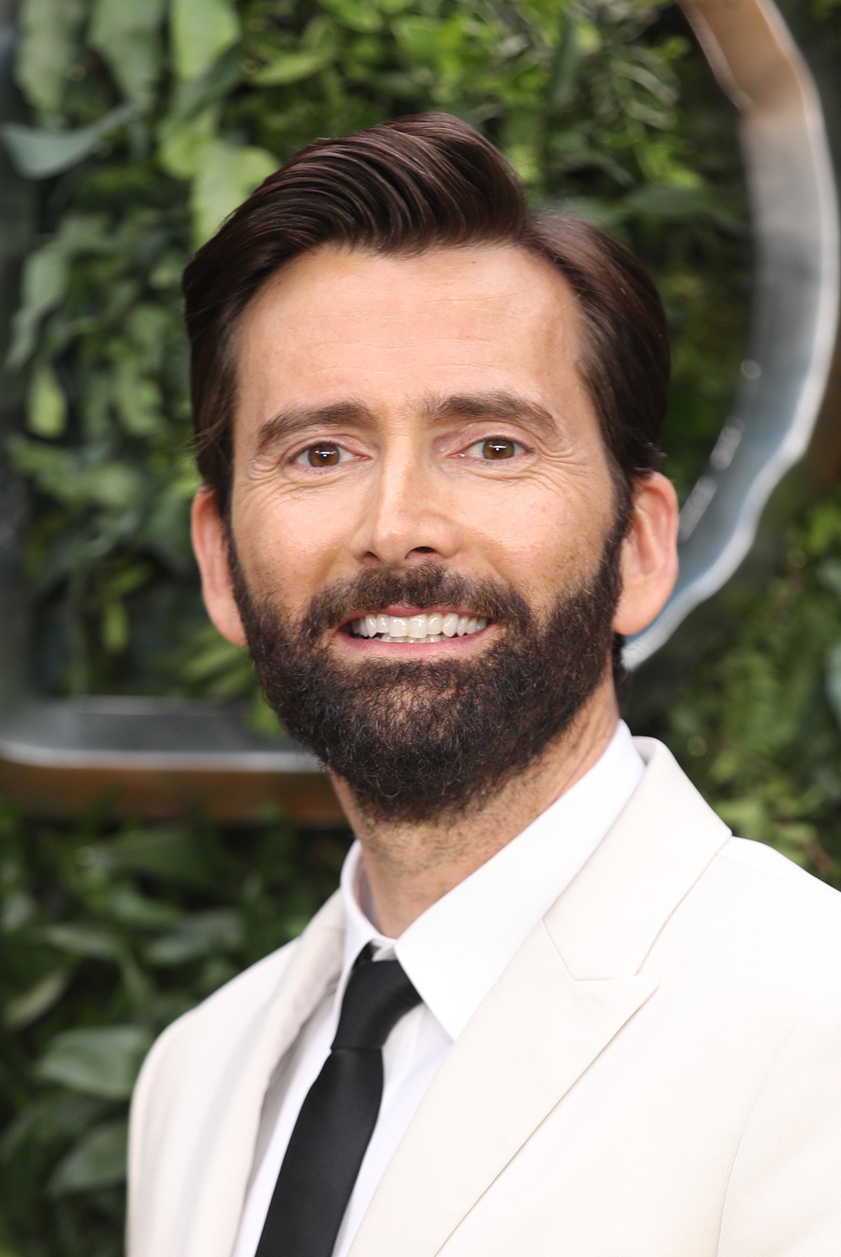 Photo of David Tennant in a white suit