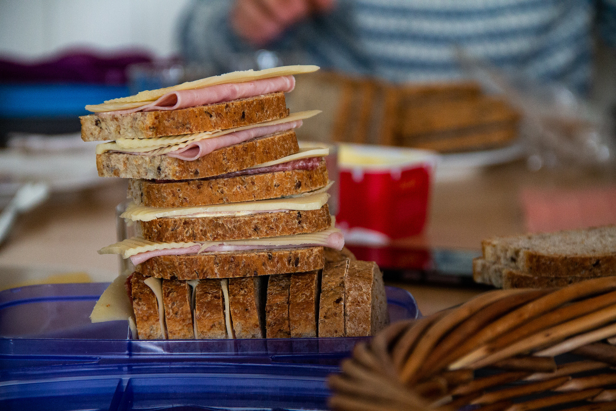 A stack of breads and sandwich meats